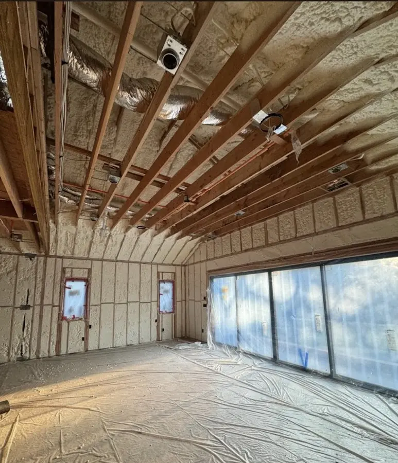 Interior walls and ceiling insulated with spray foam during new construction in Gibsonville